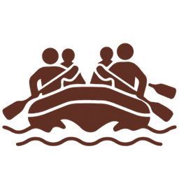 Four people paddling in a raft on water.