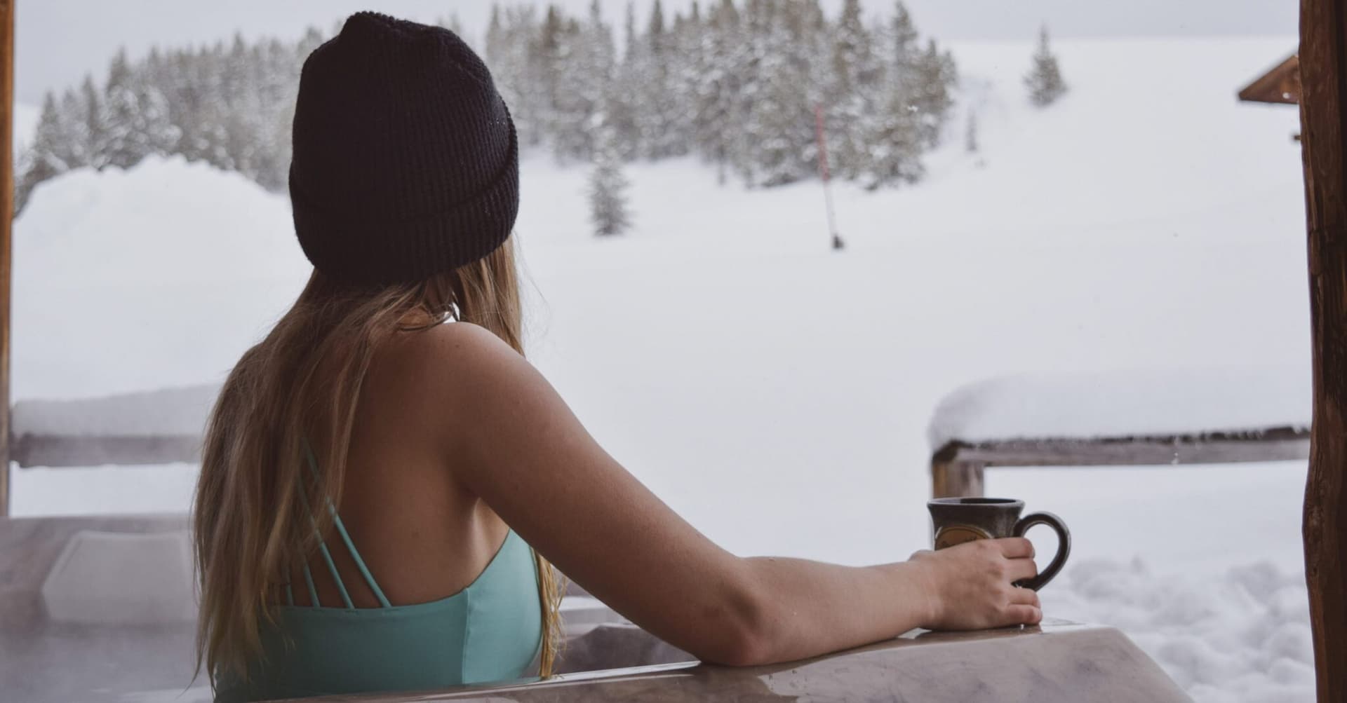 lady in hot tub with a drink